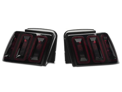 Raxiom 99-04 Ford Mustang Excluding 99-01 Cobra Icon LED Tail Lights- Black Housing (Smoked Lens) 100807 100807 Photo - Close Up