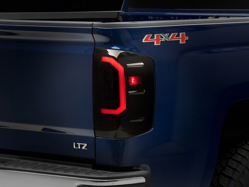 Raxiom 14-18 Chevrolet Silverado 1500 Axial Series LED Tail Lights- Blk Housing (Smoked Lens) S151298