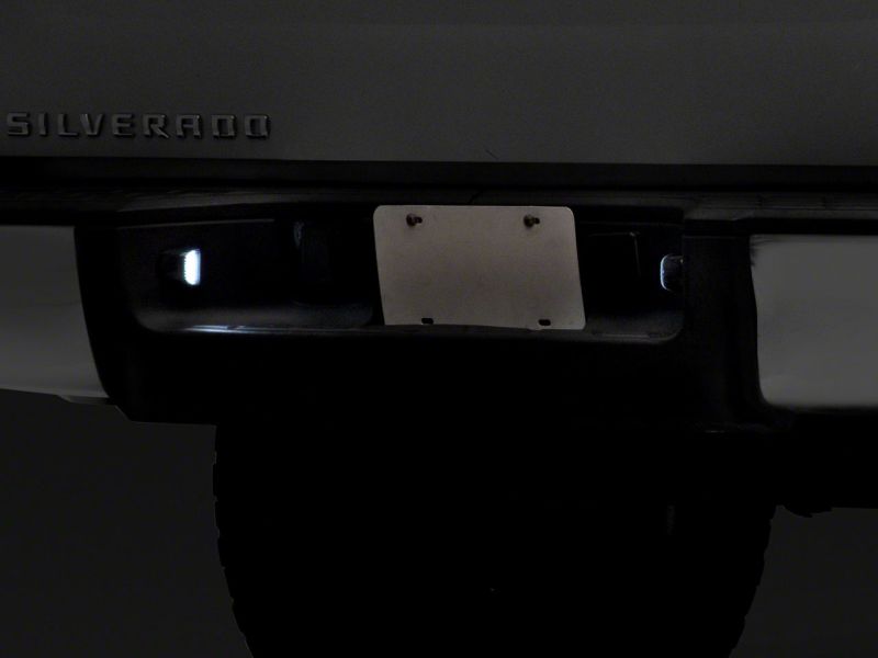 Raxiom 01-13 Chevrolet Silverado/GMC Sierra 1500 Axial Series LED License Plate Lamps- Smoked S122507 S122507 Photo - Close Up