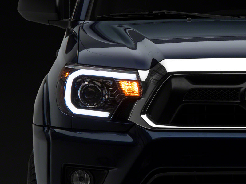 Raxiom 12-15 Toyota Tacoma Axial Projector Headlights w/ SEQL LED Bar- Blk Housing (Clear Lens) TT21850 TT21850 Photo - Primary