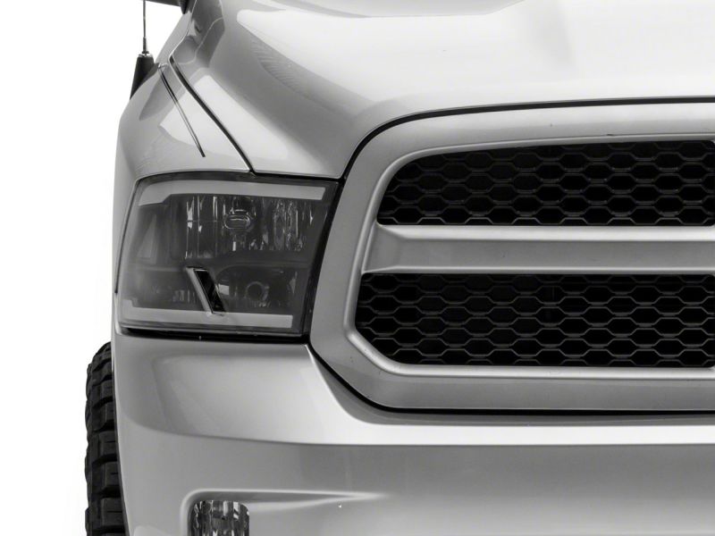 Raxiom 09-18 Dodge RAM 1500/2500/3500 Axial Series Headlights w/ LED Bar- Blk Housing (Clear Lens) R131481 R131481 Photo - Close Up