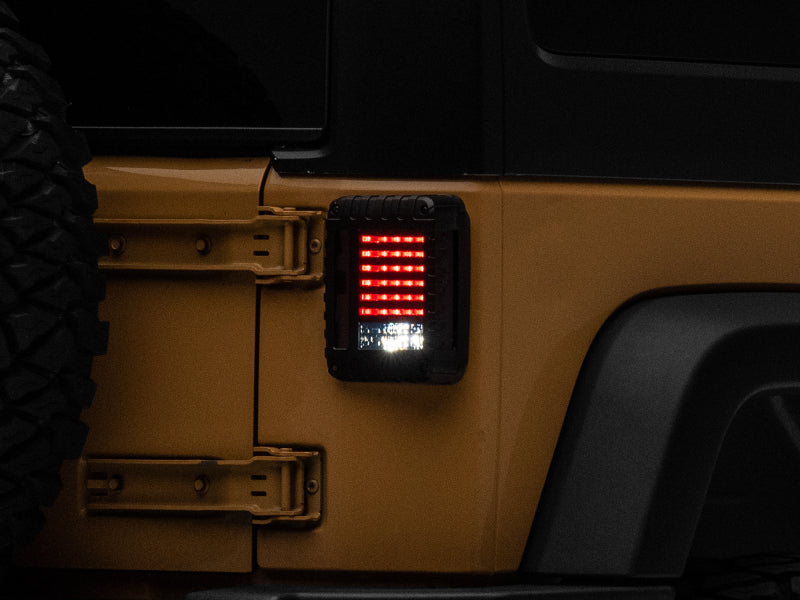 Raxiom 07-18 Jeep Wrangler JK LED Tail Lights- Black Housing (Smoked Lens) J115435 J115435 Photo - Close Up