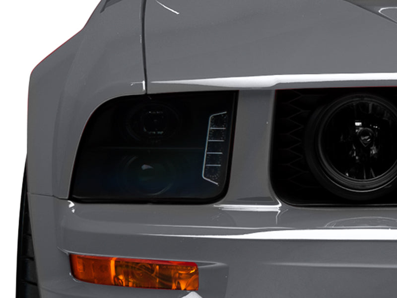 Raxiom 05-09 Ford Mustang w/ Halogen LED Halo Prjctr Headlights-Blk Hsng(Smoked Lens Exclude GT500) 49128 49128 Photo - Close Up