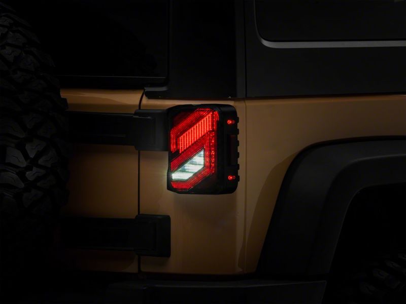 Raxiom 07-18 Jeep Wrangler JK Axial Series Trident LED Tail Lights- Blk Housing (Clear Lens) J173719 J173719 Photo - Close Up