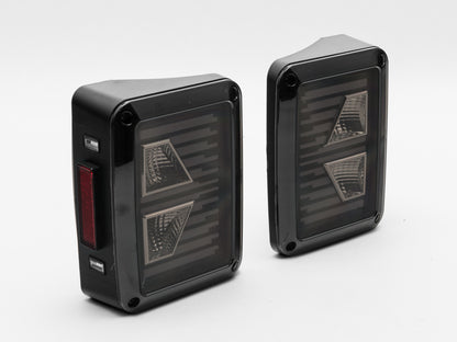 Raxiom 07-18 Jeep Wrangler JK Axial Series Vision LED Tail Lights- Black Housing (Smoked Lens) J130808 J130808 Photo - Close Up