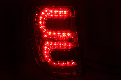 Anzo 1999-2004 Jeep Grand Cherokee LED Taillights Red/Smoke 311180 Photo - Mounted