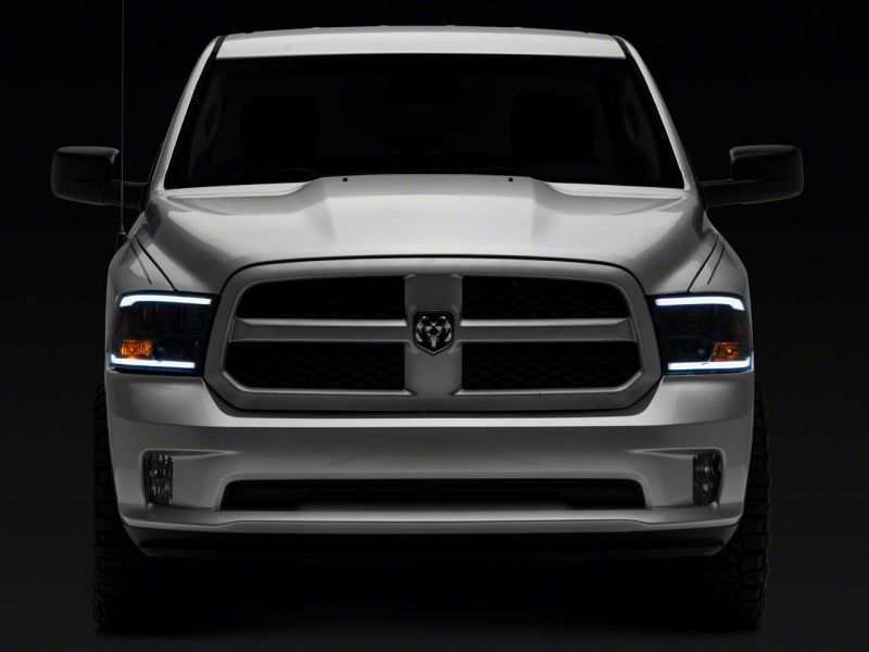 Raxiom 09-18 Dodge RAM 1500/2500/3500 Axial Series Headlights w/ LED Bar- Blk Housing (Clear Lens) R131481 R131481 Photo - Close Up