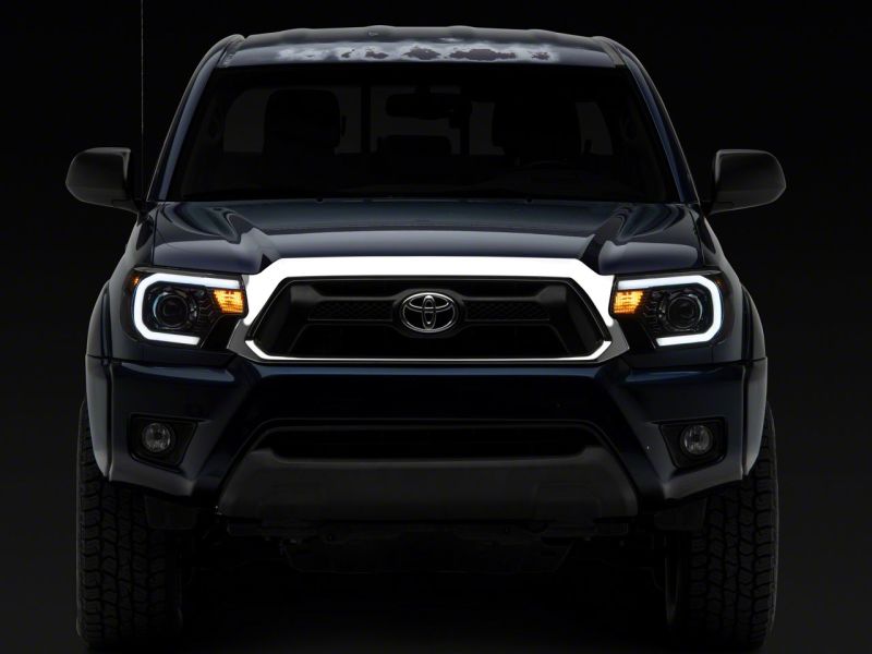 Raxiom 12-15 Toyota Tacoma Axial Series Projector Headlights w/ LED Bar- Blk Housing (Clear Lens) TT21849 TT21849 Photo - Close Up