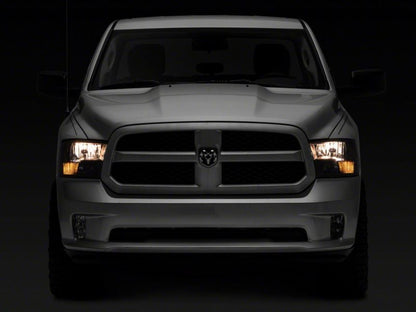 Raxiom 09-18 Dodge RAM 1500 Axial Series Euro Style Headlights w/ Dual Bulb Blk Housing (Clear Lens) R118016 R118016 Photo - Close Up