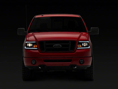 Raxiom 04-08 Ford F-150 Axial Series Projector Headlights w/ SEQL LED Bar- Blk Housing (Clear Lens) T566364 T566364 Photo - Close Up