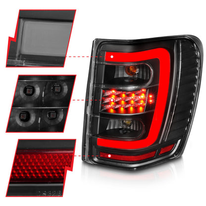 ANZO 1999-2004 Jeep Grand Cherokee LED Tail Lights w/ Light Bar Black Housing Clear Lens 311394 311394 Photo - Unmounted