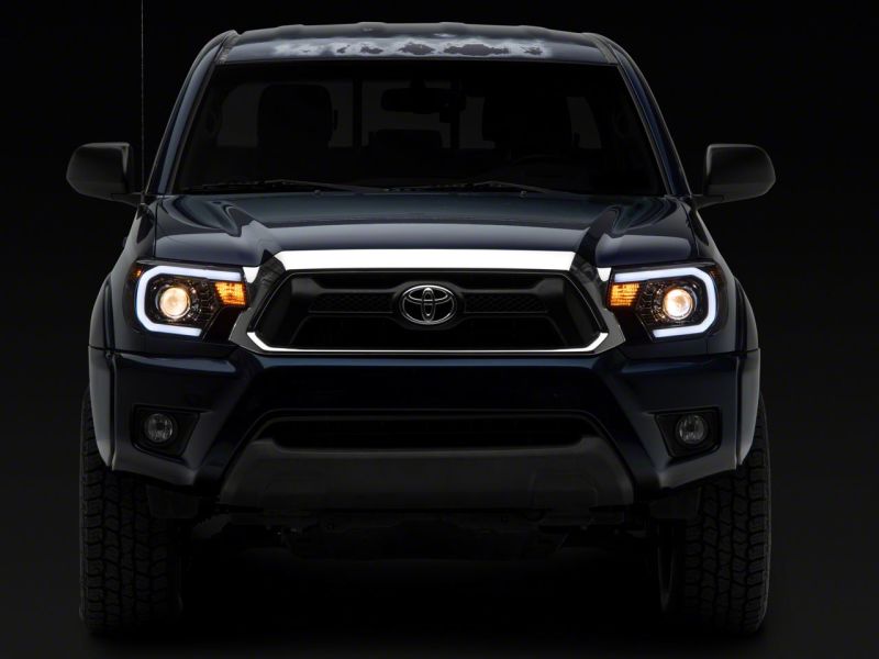 Raxiom 12-15 Toyota Tacoma Axial Projector Headlights w/ SEQL LED Bar- Blk Housing (Clear Lens) TT21850 TT21850 Photo - Close Up