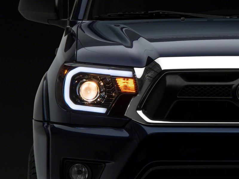 Raxiom 12-15 Toyota Tacoma Axial Projector Headlights w/ SEQL LED Bar- Blk Housing (Clear Lens) TT21850 TT21850 Photo - Close Up