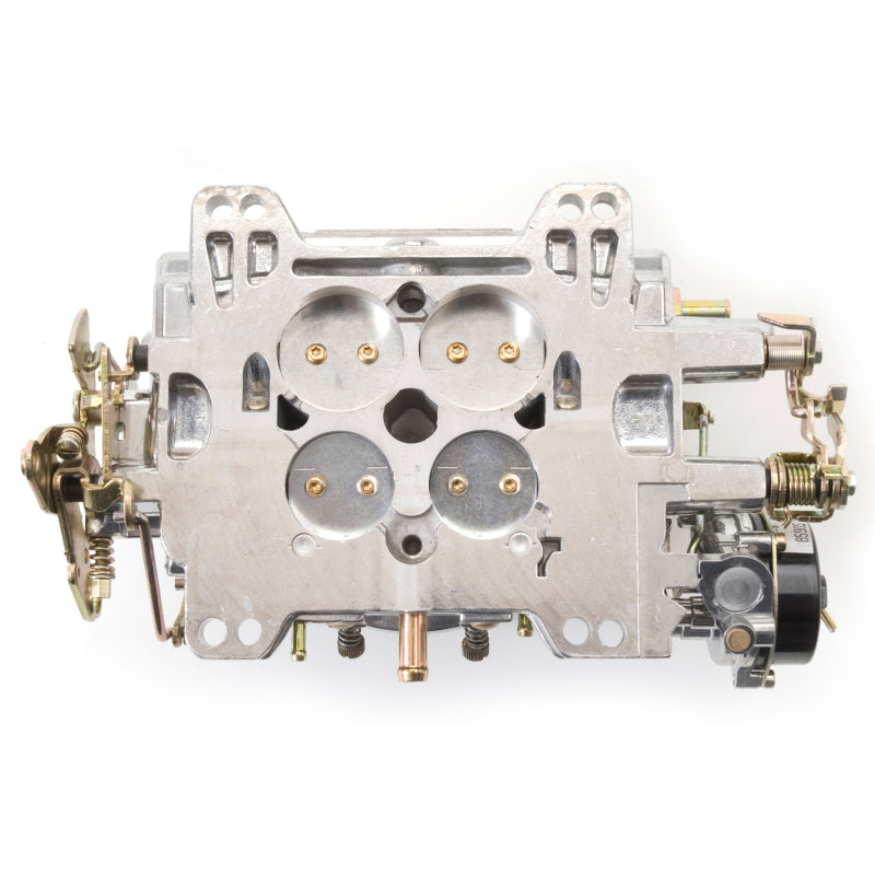 Edelbrock Reconditioned Carb #1406, 1 7/8" x 3 1/2"  Steel Collector w/ 7-8" 9906 Photo - out of package