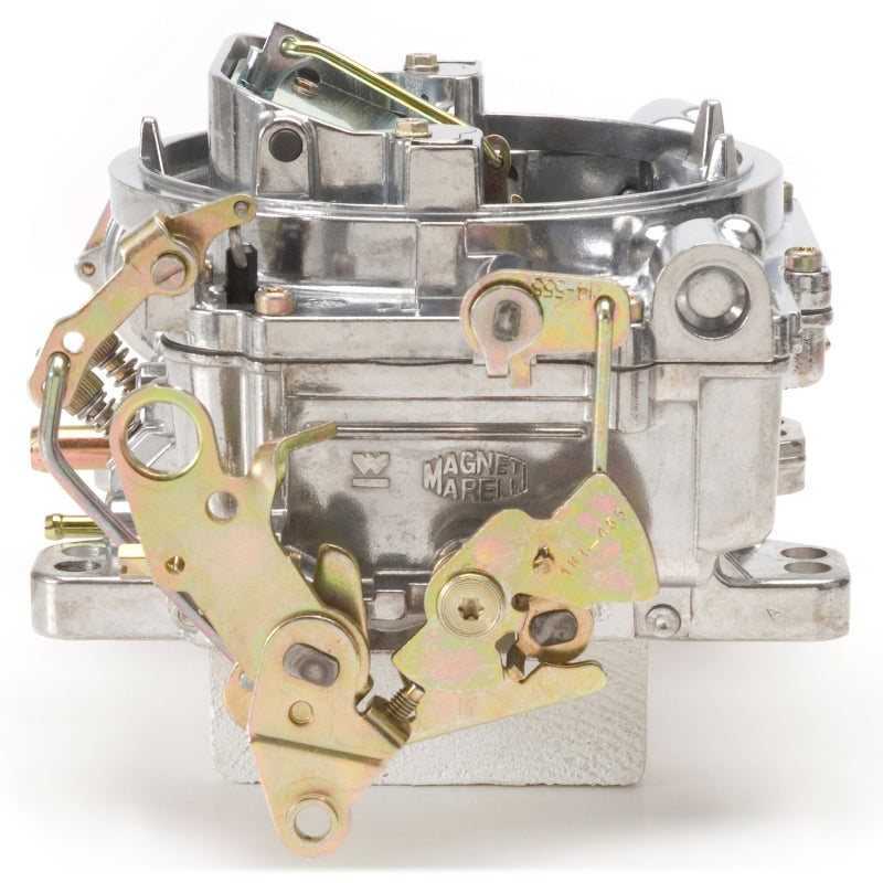 Edelbrock Reconditioned Carb #1406, 1 7/8" x 3 1/2"  Steel Collector w/ 7-8" 9906 Photo - out of package