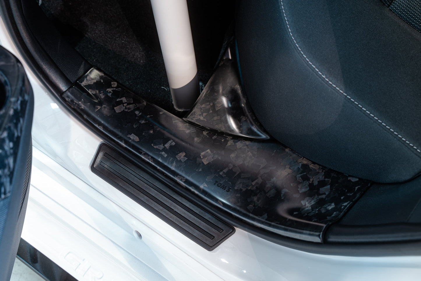 TOM'S Racing Forged Carbon Rear Scuff Plate Cover - Toyota GR Corolla [2023+]