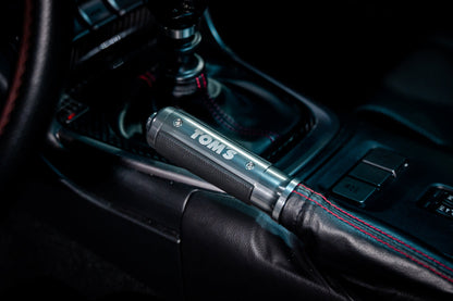 TOM'S Racing Aluminum Side Brake Grip [LHD] for Toyota GR86 / Subaru BRZ (2022+) & Toyota 86 / Scion FRS / Subaru BRZ (13~20)