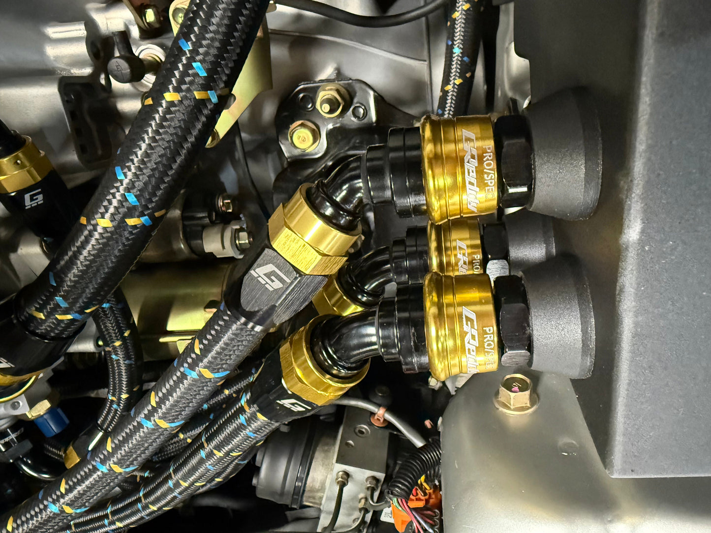 GReddy 8 Nylon Braided Hose (per/ft) - Black / Gold / Blue