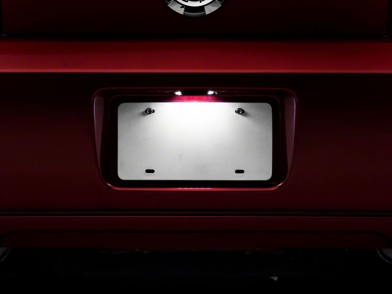 Raxiom 05-09 Ford Mustang Axial Series LED License Plate Lamps 413032 413032 Photo - Close Up