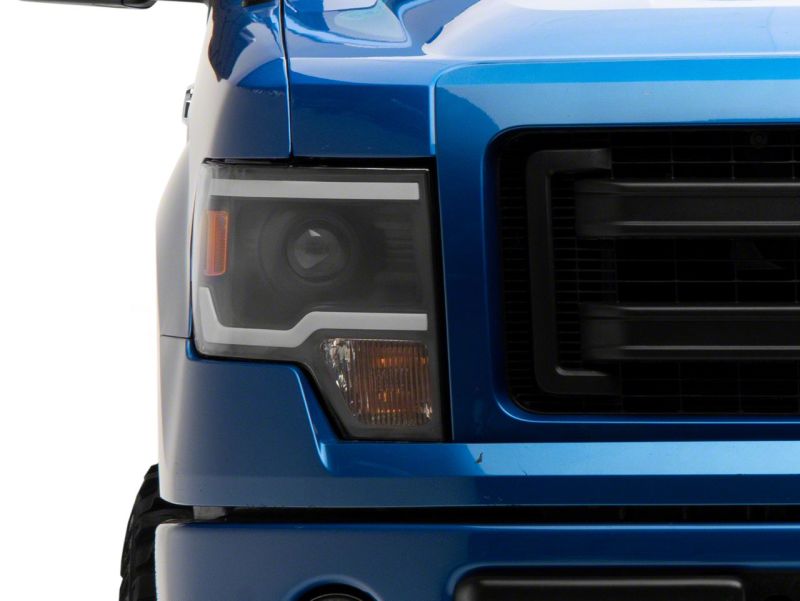 Raxiom 09-14 Ford F-150 Axial Series Projector Headlights w/ LED Light Bar- Blk Housing (Clear Lens) T566369 T566369 Photo - Close Up