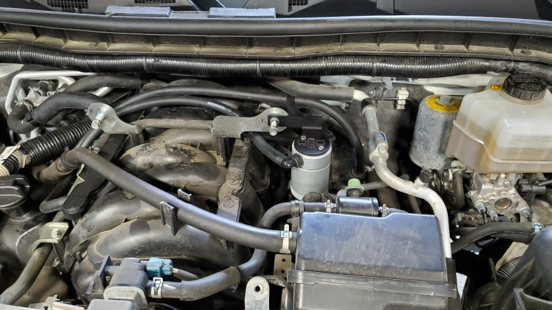 J&L 17-23 Nissan Armada / 14-23 Infiniti QX80 5.6L Driver Side Oil Separator 3.0 - Clear Anodized 3118D-C 3118D-C Photo - Mounted