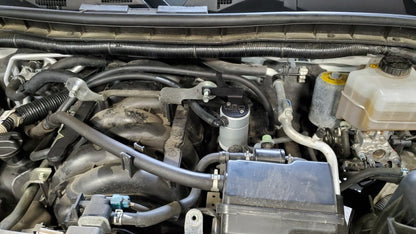 J&L 17-23 Nissan Armada / 14-23 Infiniti QX80 5.6L Driver Side Oil Separator 3.0 - Clear Anodized 3118D-C 3118D-C Photo - Mounted