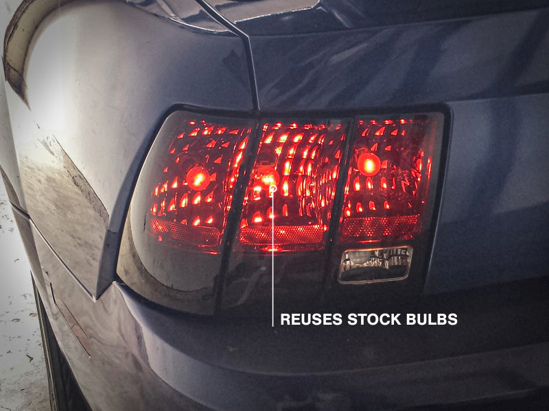 Raxiom 99-04 Ford Mustang Excluding 99-01 Cobra Tail Lights- Black Housing (Smoked Lens) 49080 49080 Photo - Close Up