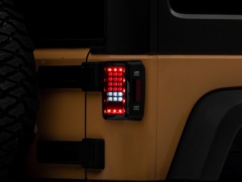 Raxiom 07-18 Jeep Wrangler JK Axial Series LED Tail Lights- Blk Housing (Clear Lens) J141585 J141585 Photo - Close Up