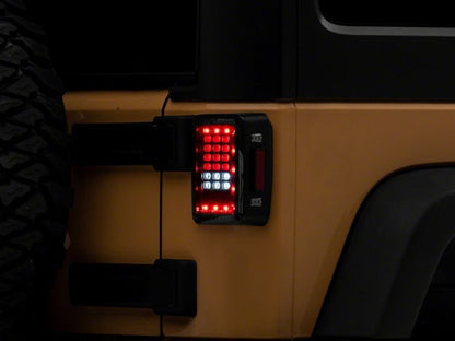 Raxiom 07-18 Jeep Wrangler JK Axial Series LED Tail Lights- Blk Housing (Clear Lens) J141585 J141585 Photo - Close Up