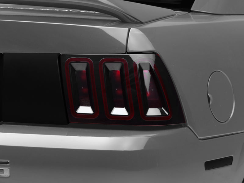 Raxiom 99-04 Ford Mustang Excluding 99-01 Cobra Icon LED Tail Lights- Black Housing (Smoked Lens) 100807 100807 Photo - Close Up