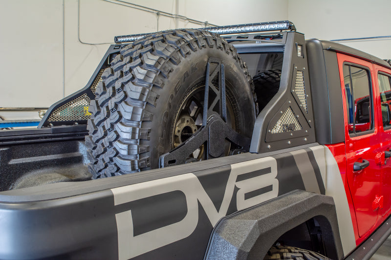 DV8 Offroad 2019+ Jeep Gladiator Universal Stand Up In-Bed Tire Carrier TCGL-02 TCGL-02 Photo - Mounted