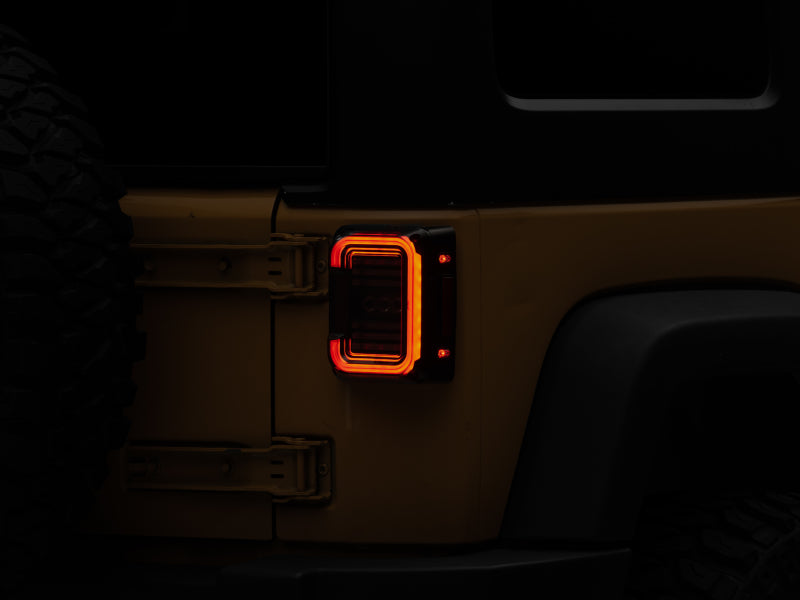 Raxiom 07-18 Jeep Wrangler JK Axial Series LED Halo Tail Lights- Black Housing (Dark Smoked Lens) J138358 J138358 Photo - Primary
