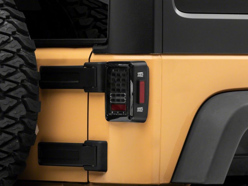 Raxiom 07-18 Jeep Wrangler JK Axial Series LED Tail Lights- Blk Housing (Clear Lens) J141585 J141585 Photo - Close Up