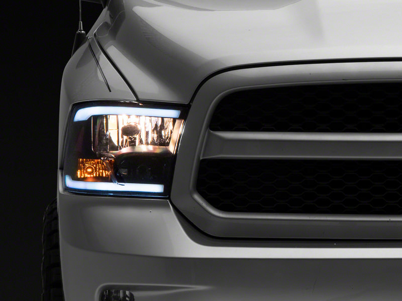 Raxiom 09-18 Dodge RAM 1500/2500/3500 Axial Headlights w/ SEQL LED Bar- Blk Housing (Clear Lens) R131482 R131482 Photo - Primary