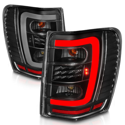 ANZO 1999-2004 Jeep Grand Cherokee LED Tail Lights w/ Light Bar Black Housing Clear Lens 311394 311394 Photo - Unmounted