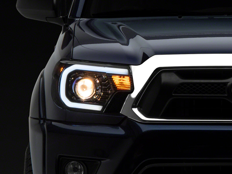 Raxiom 12-15 Toyota Tacoma Axial Series Projector Headlights w/ LED Bar- Blk Housing (Clear Lens) TT21849 TT21849 Photo - Primary