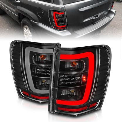 ANZO 1999-2004 Jeep Grand Cherokee LED Tail Lights w/ Light Bar Black Housing Clear Lens 311394 311394 Photo - Primary