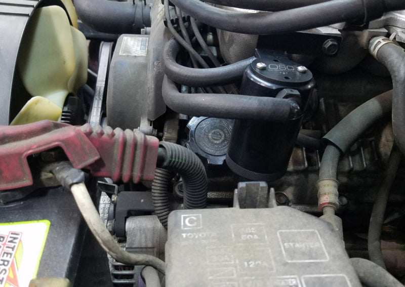 J&L 95-04 Toyota Tacoma/4Runner 3.4L Driver Side Oil Separator 3.0 - Black Anodized 3101D-B 3101D-B Photo - Mounted