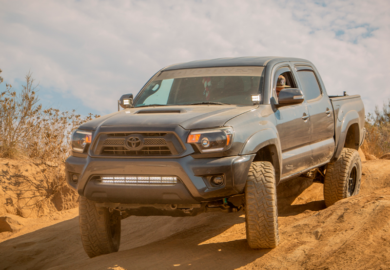 Cali Raised LED Cali Raised 05-15 Toyota Tacoma Low Prof Ditch Light Brackets Kit W/ Blue Backlight - Small CR2862 CR2862 Photo - Primary