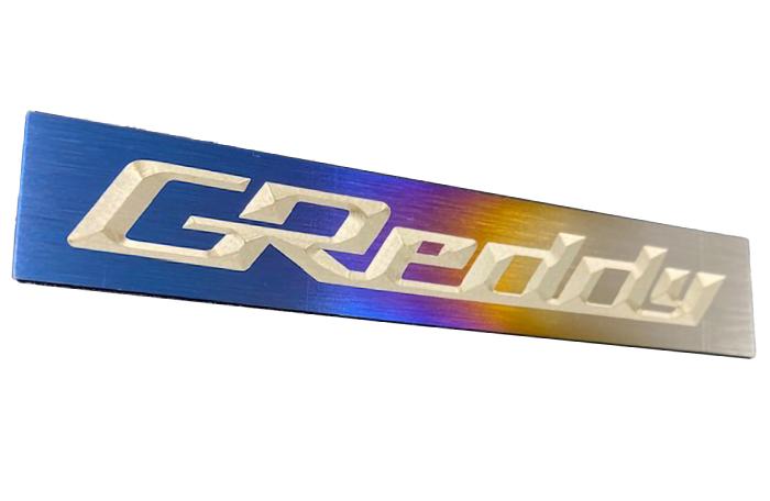 GReddy Optional Titanium GReddy Emblem - (105x20mm)