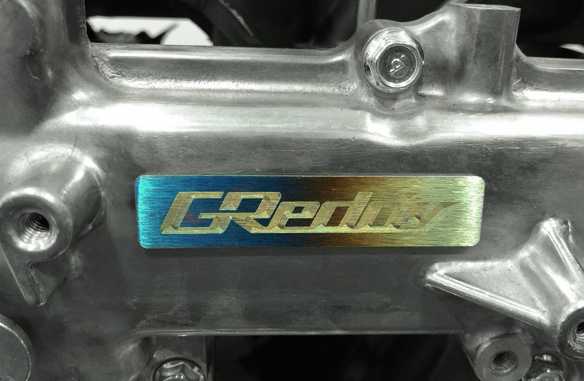 GReddy Titanium GReddy Emblem - (70x15mm) - NEW