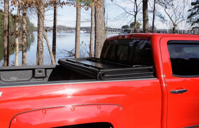 Lund 05-15 Toyota Tacoma Fleetside (6ft. Bed) Hard Fold Tonneau Cover - Black 969550