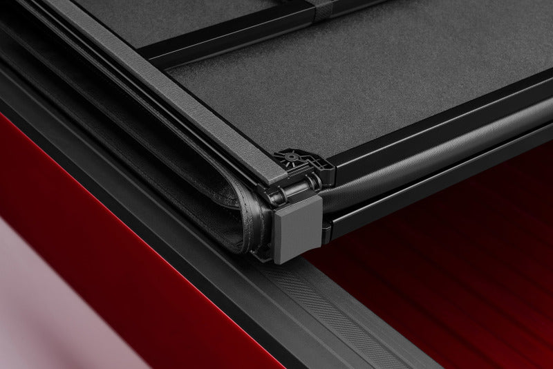 Lund 04-15 Nissan Titan (6.7ft. Bed) Hard Fold Tonneau Cover - Black 969451