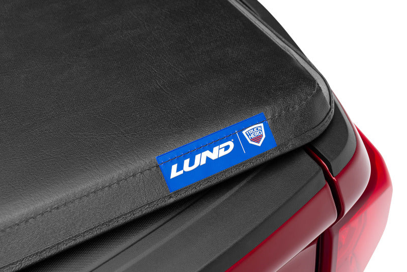 Lund 04-15 Nissan Titan (6.7ft. Bed) Hard Fold Tonneau Cover - Black 969451